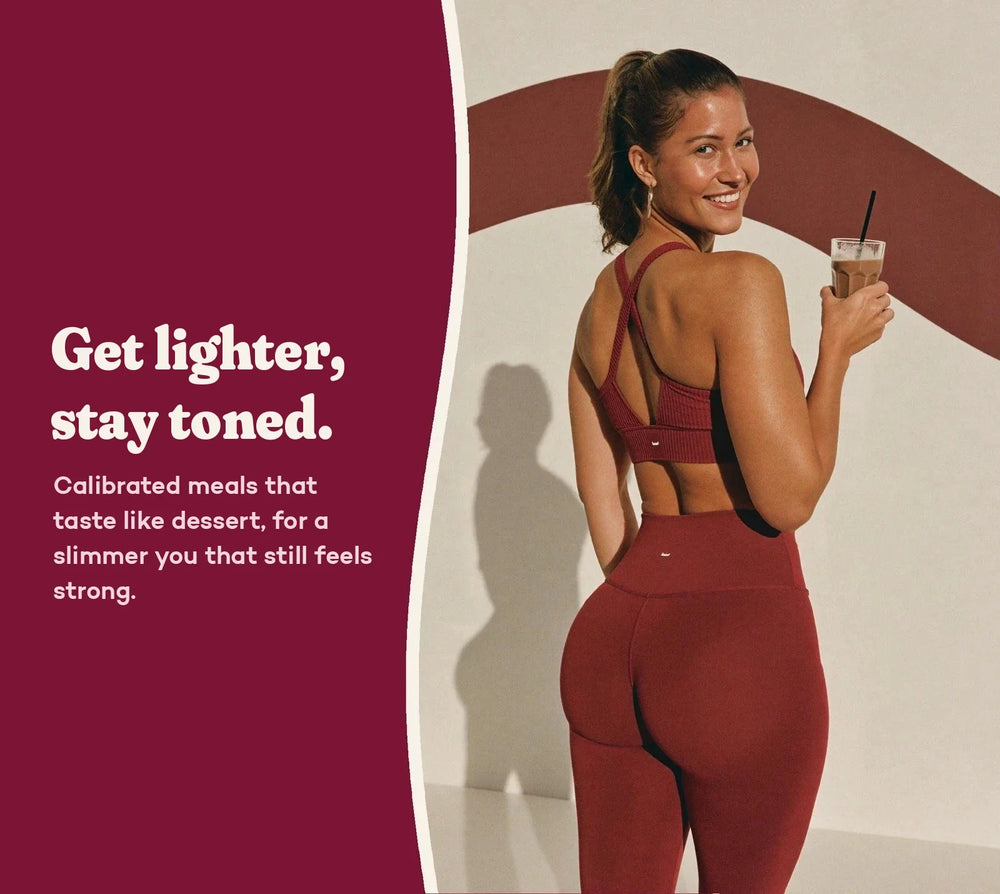 A woman in a bordeaux outfit holding her shake