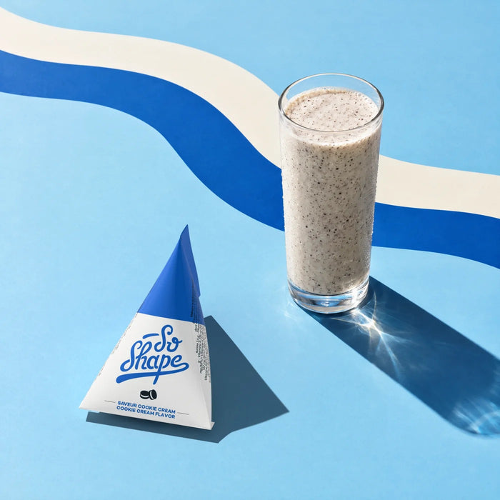 Cookies & Cream shake in a glass next to its So Shape sachet