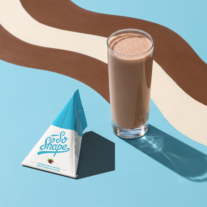 Coconut Chocolate shake in a glass next to its So Shape sachet